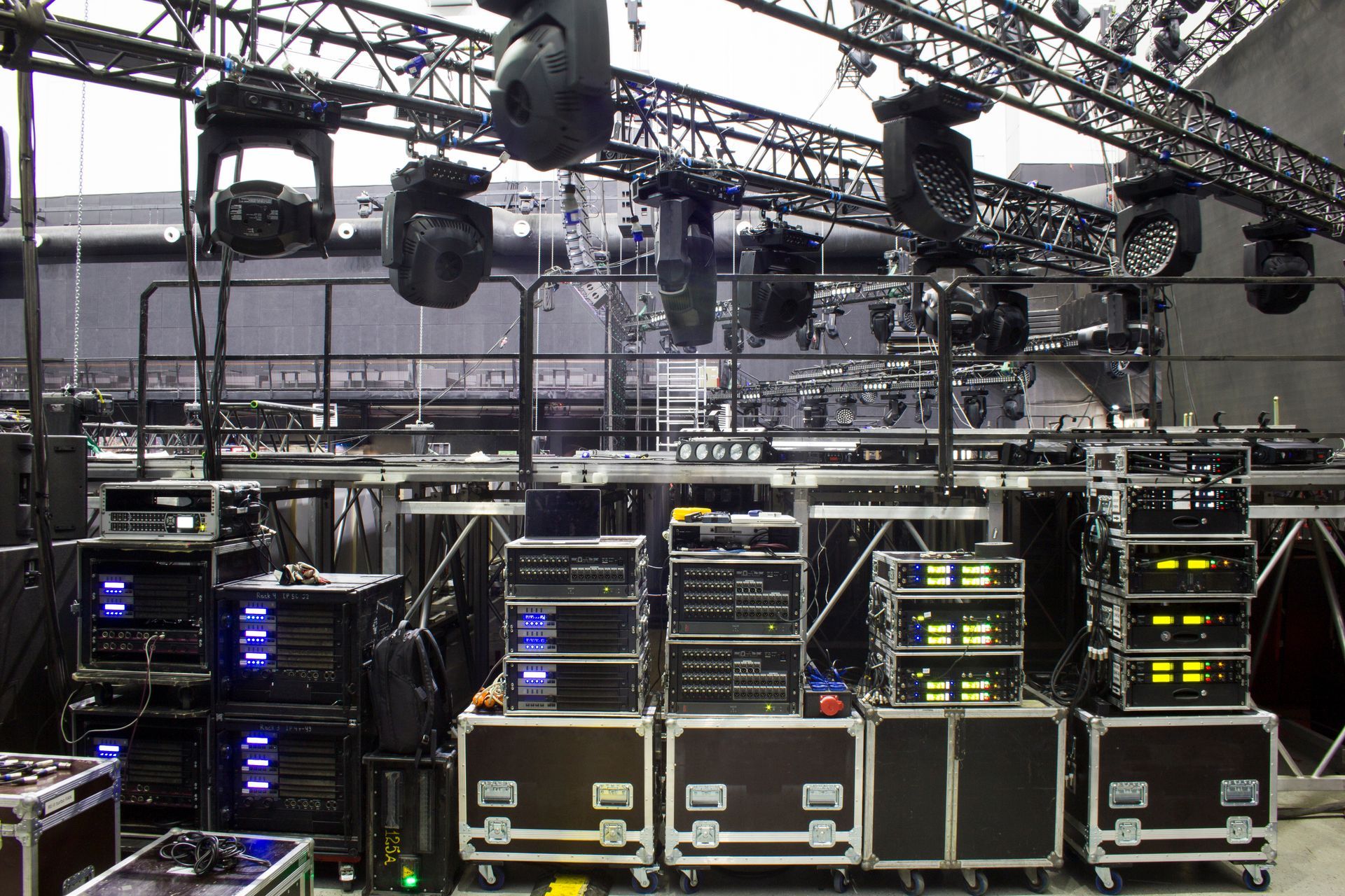 A bunch of cases are stacked on top of each other in a room