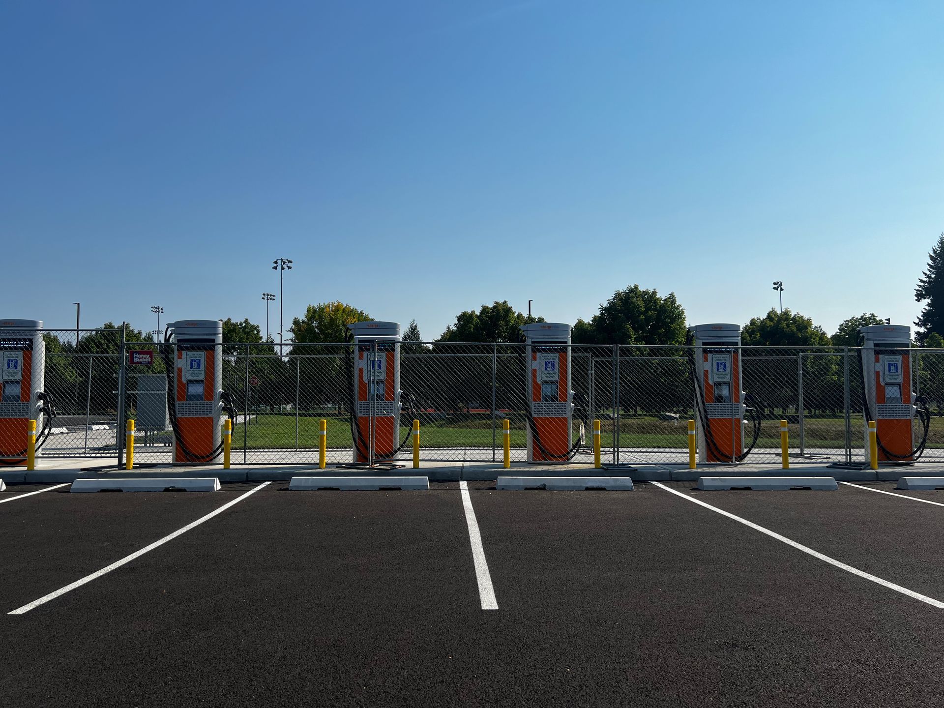 A row of charging stations in a parking lot