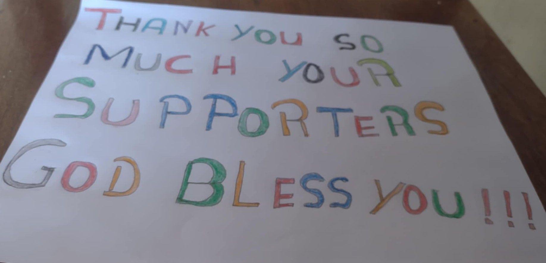 A student's letter-drawing that says 