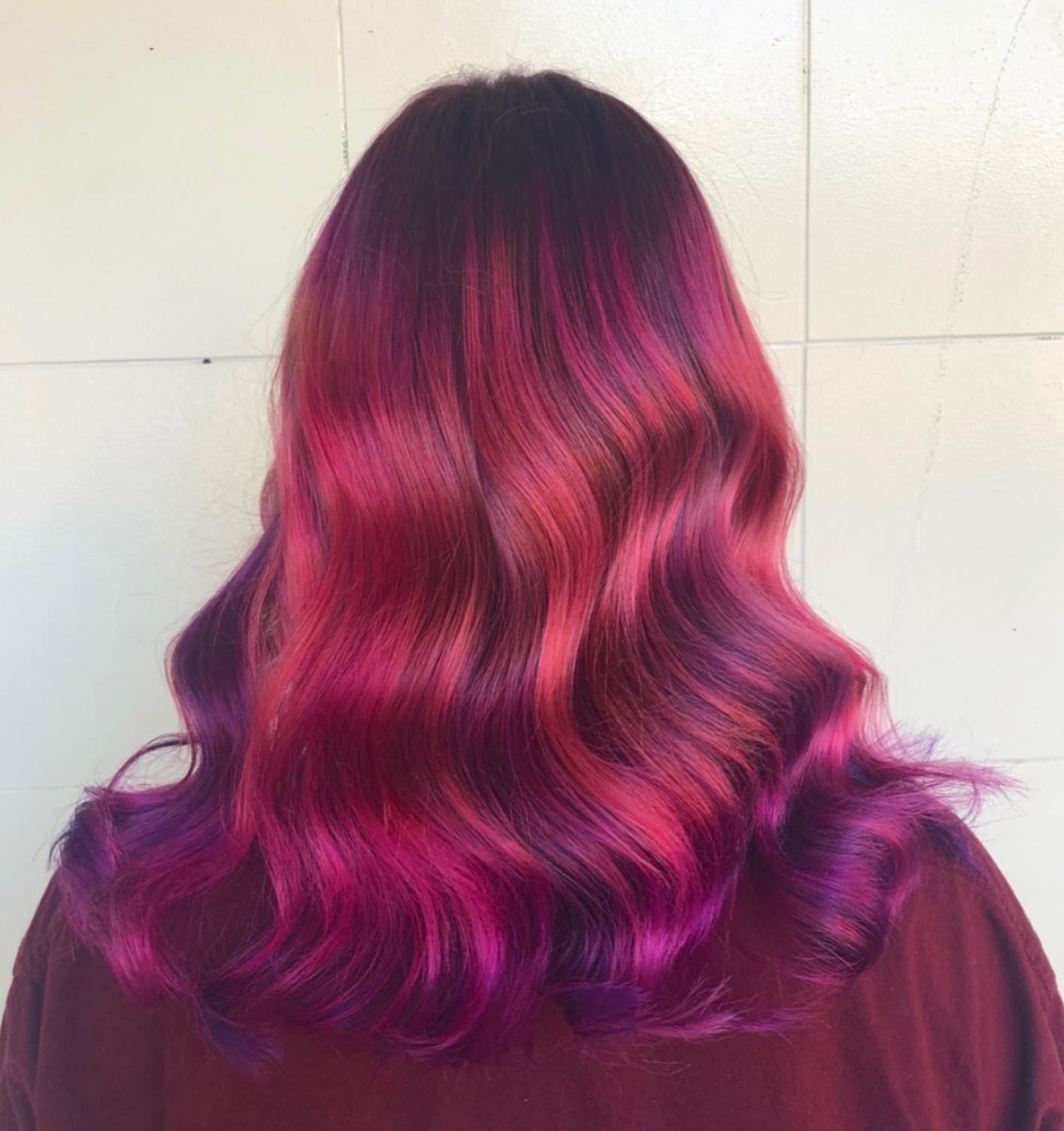 A woman's hair with red curls and purple ends — Carlee Hair Design In Anula, NT