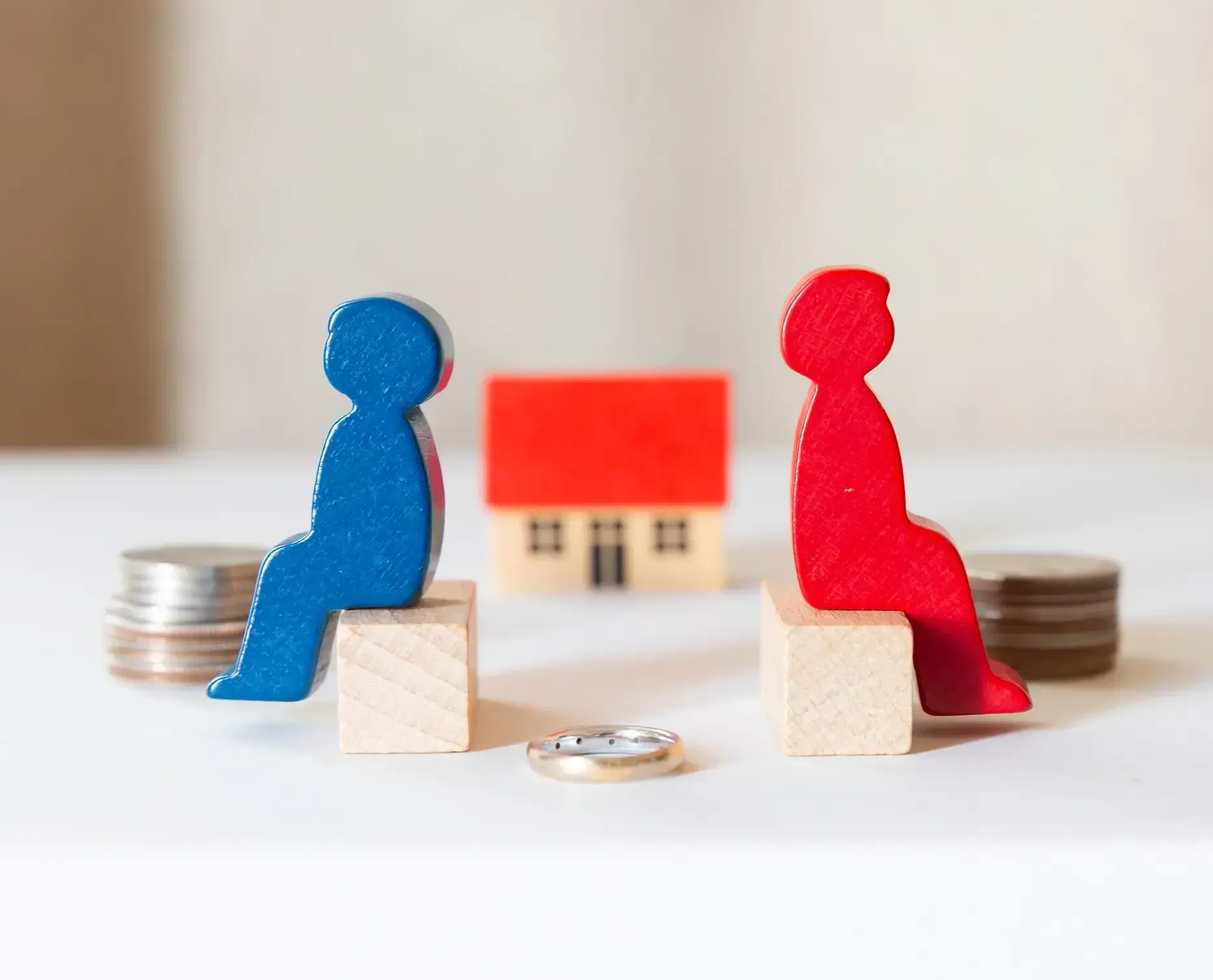 Two wooden figurines, one blue and one red.
