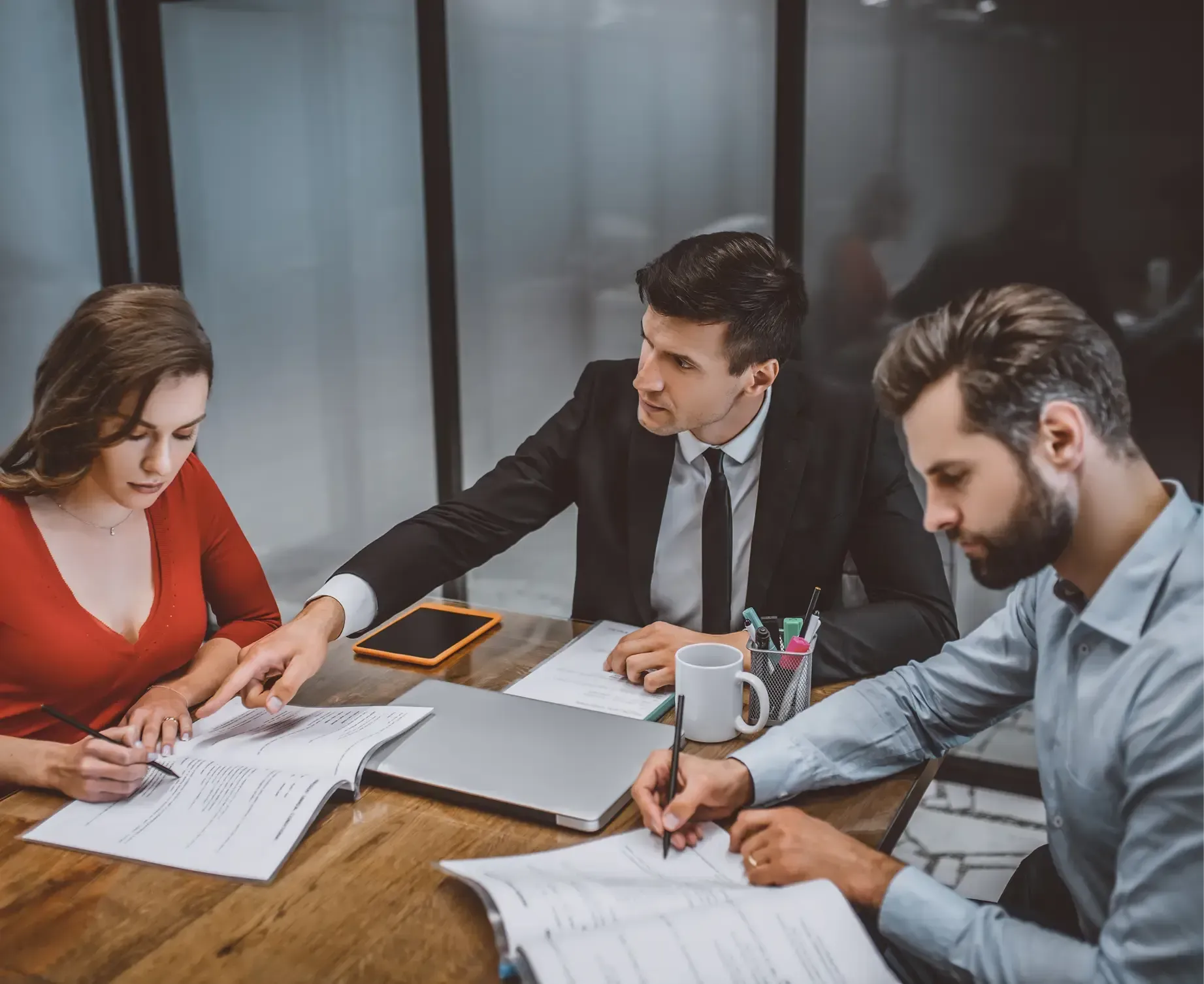 Three people discussing on a table