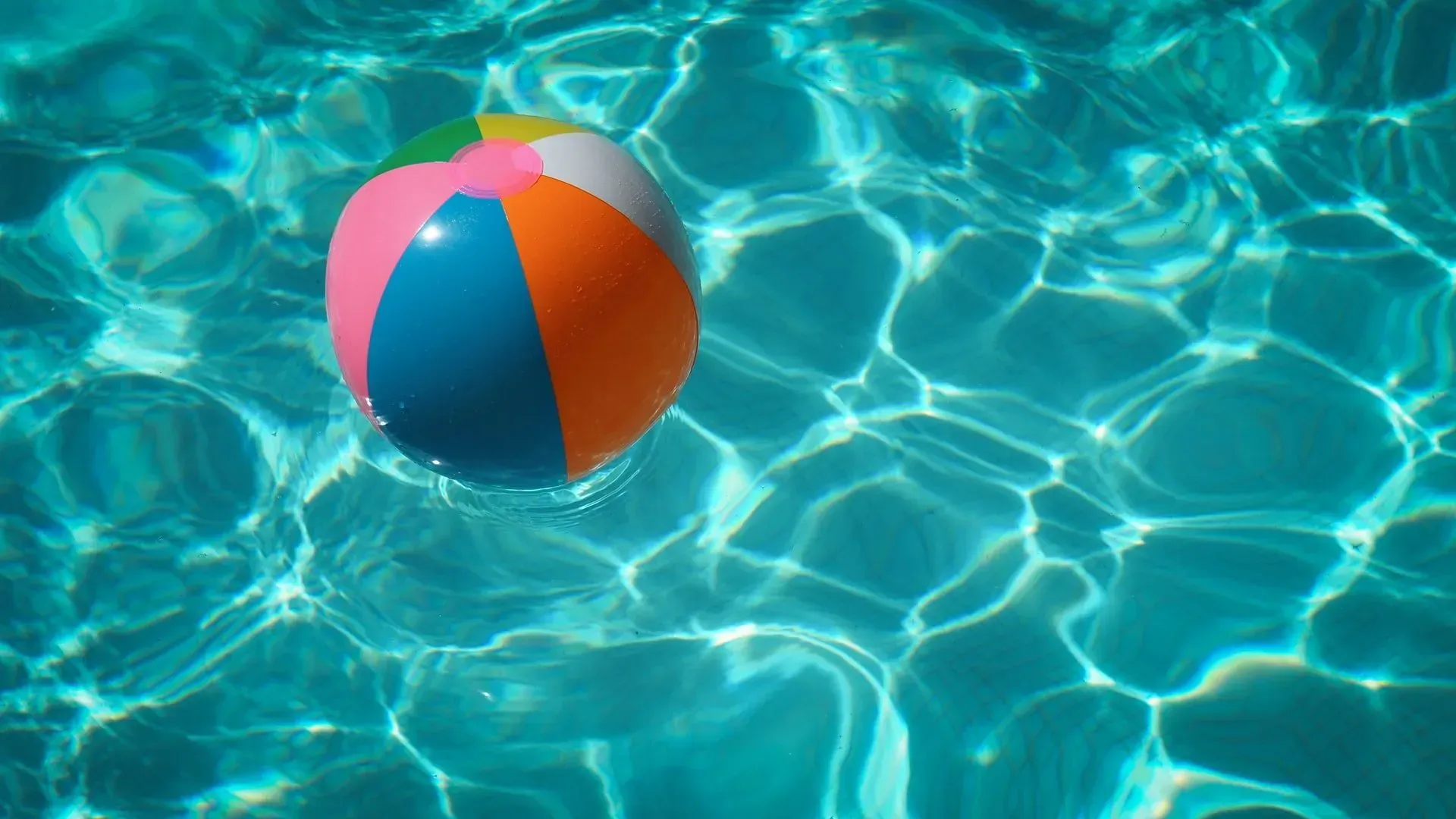 swimming ball floats in swimming pool
