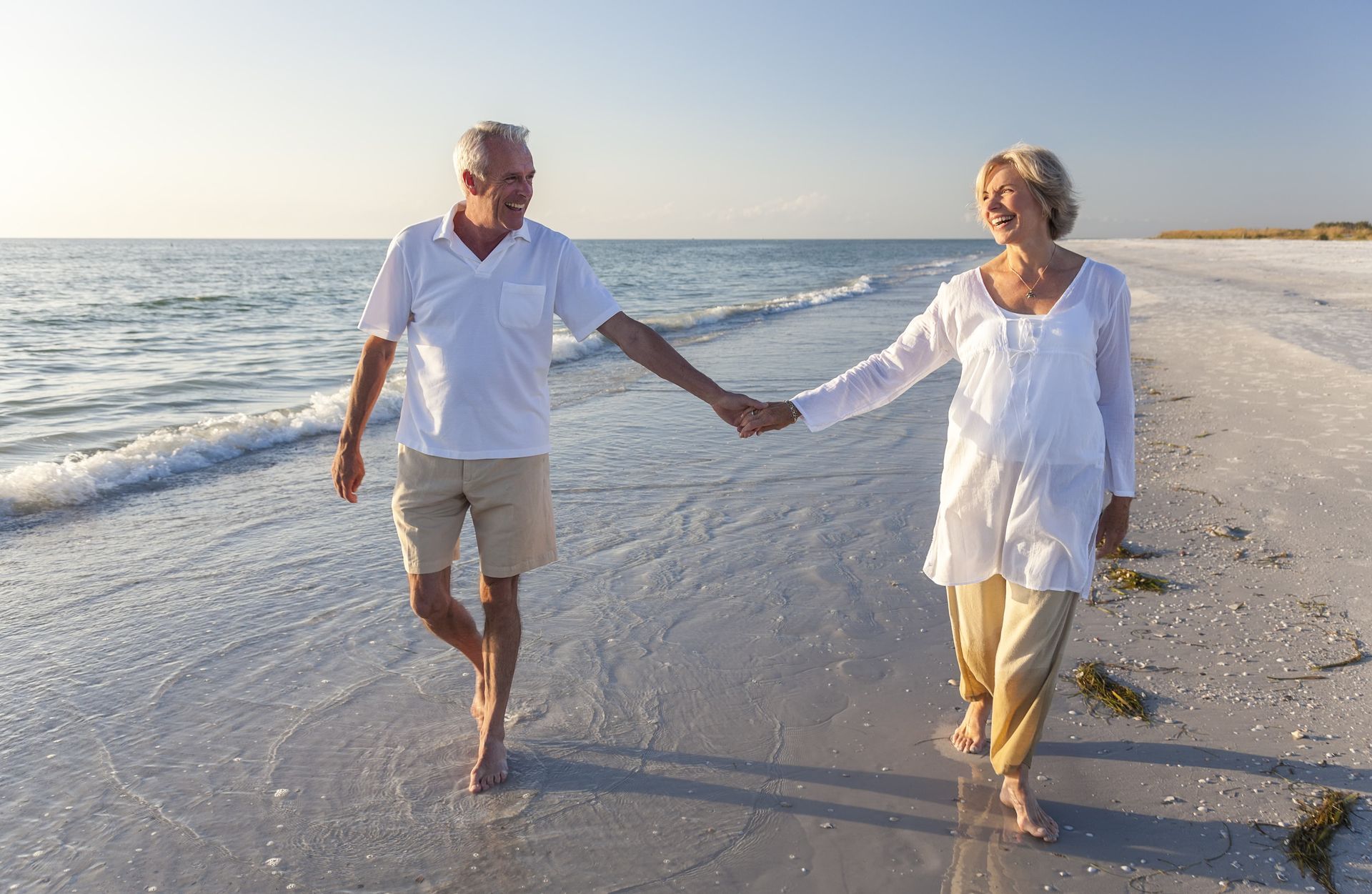 two grandparents holding hands