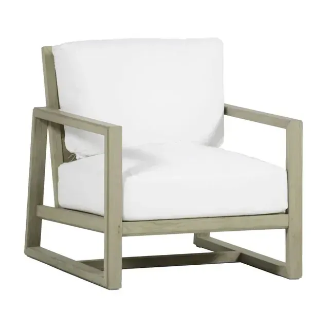 Outdoor armchair with white cushions and gray wooden frame.