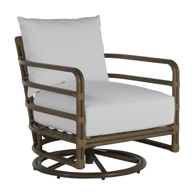 Brown rattan swivel chair with white cushions.