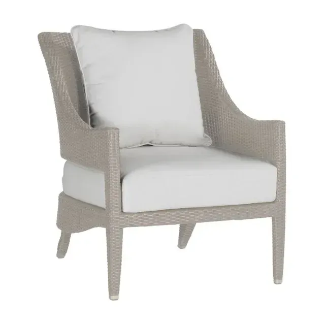 Wicker outdoor armchair with white cushions; light beige color.