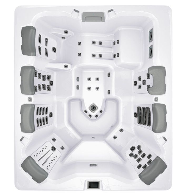 Overhead view of a white hot tub with gray headrests and multiple jet placements.