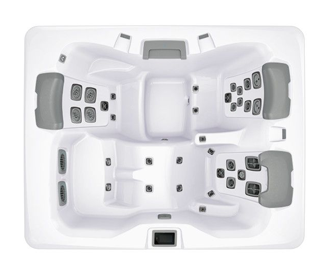 Overhead view of a white hot tub with six seating areas, gray headrests, and control panels.