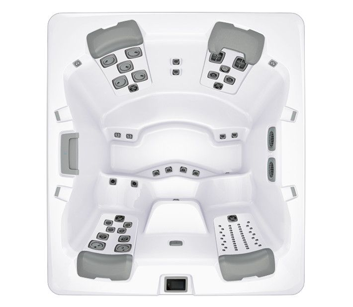 Top-down view of a square, white hot tub with gray seating and control panels.