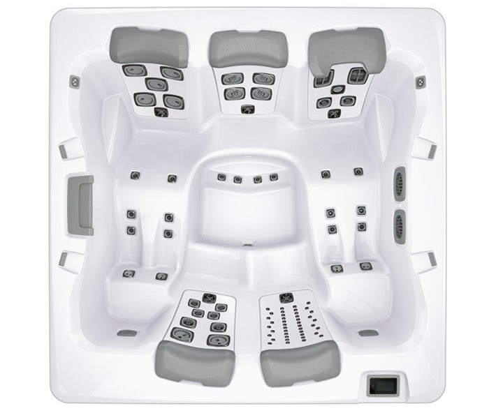 Top-down view of a white hot tub with multiple gray seats and jet configurations.