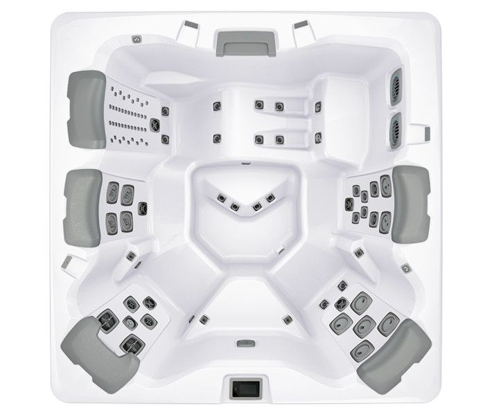 Top-down view of a white hot tub with gray seating and jets.