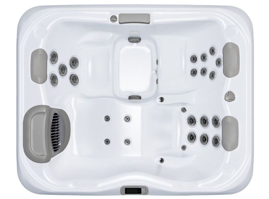 Overhead view of a white hot tub with gray headrests and multiple jets.