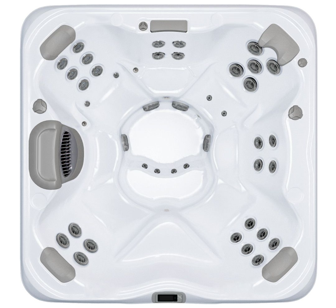 Overhead view of a white square hot tub with grey headrests and numerous water jets.