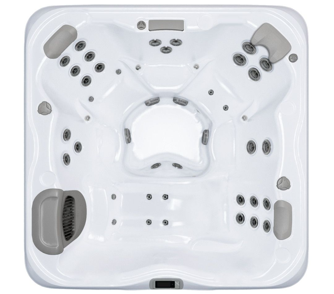 Top-down view of a white hot tub with multiple gray jets, headrests, and seats.