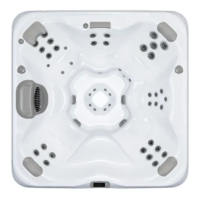 Top-down view of a white square hot tub with gray headrests and jets.