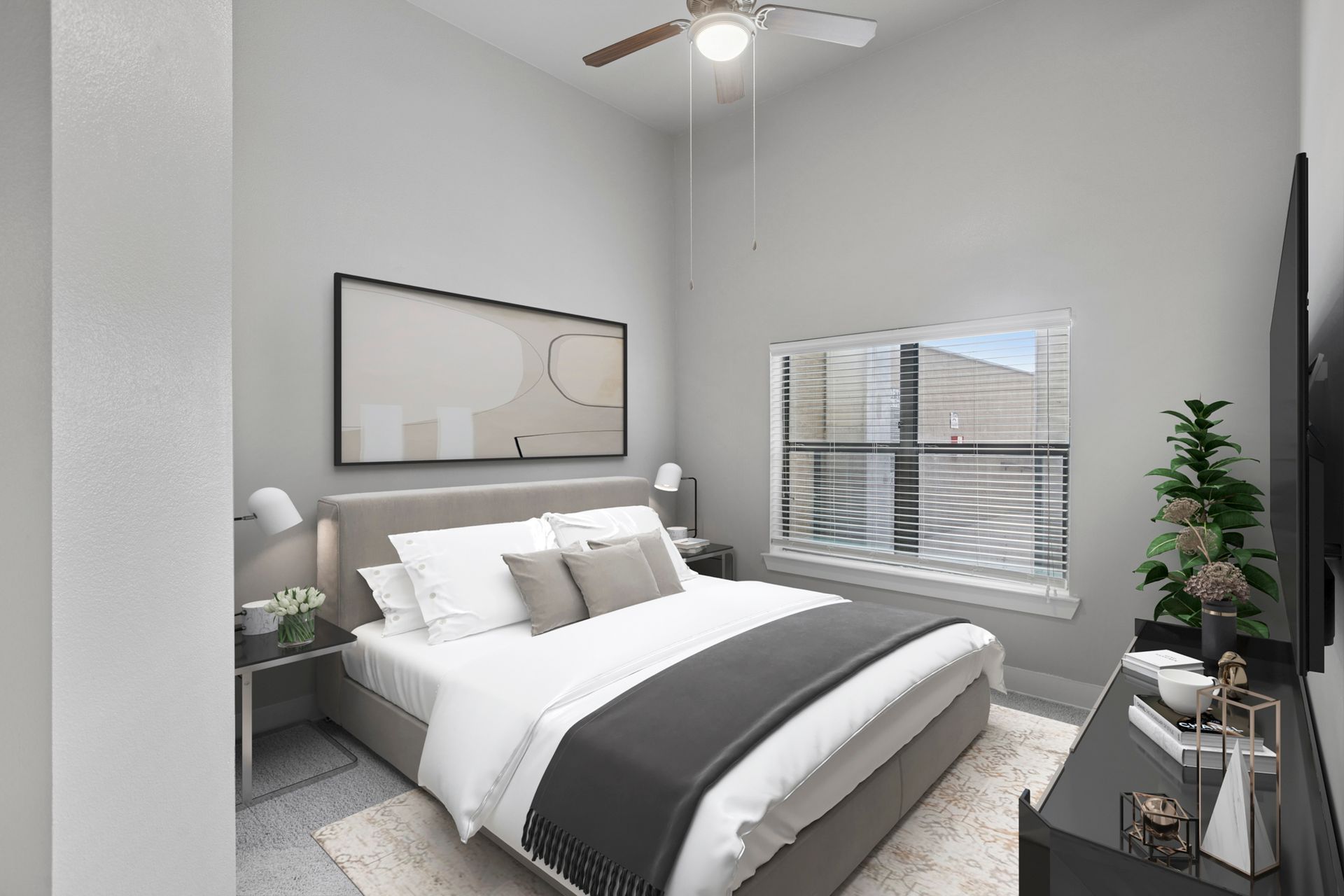 Bedroom with gray walls, bed, window, TV, and decorative items.