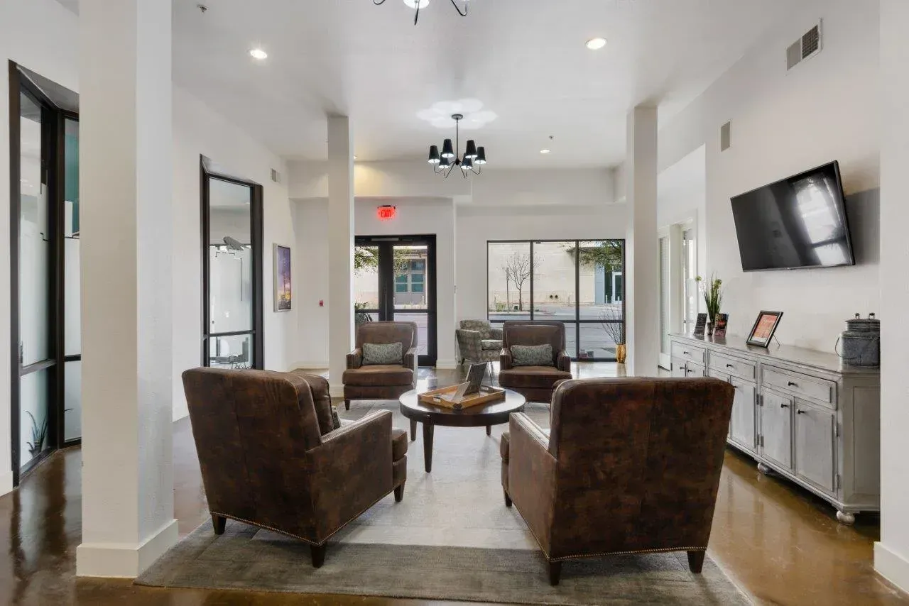 A living room filled with furniture and a flat screen tv.