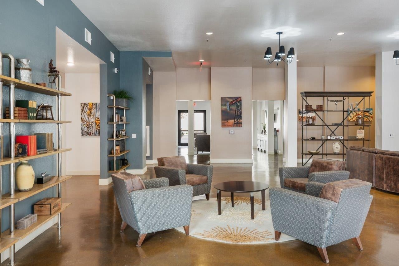 A living room filled with furniture and a table.