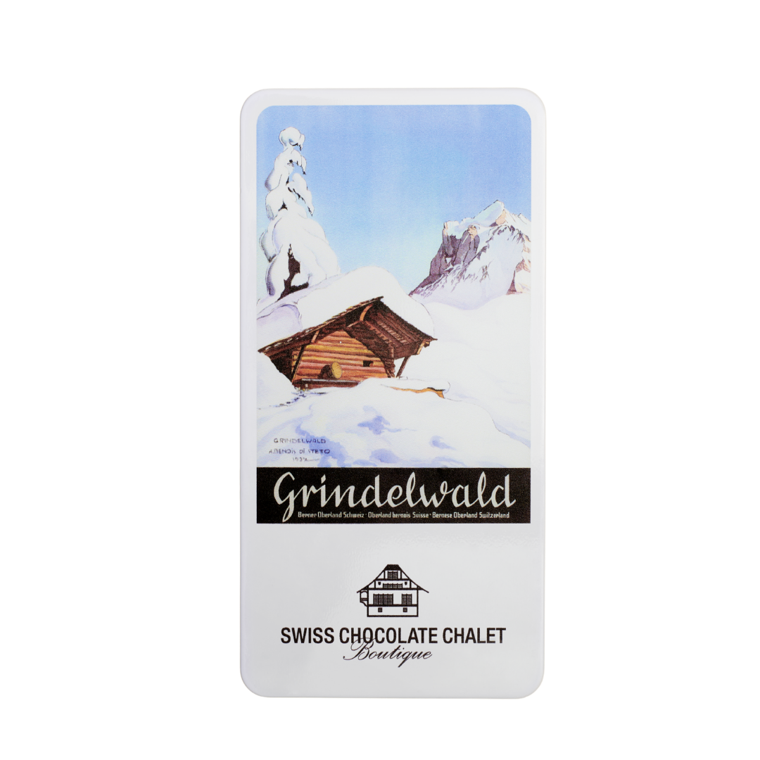 Schweizer Schokoladenverpackung mit verschneitem Chalet und Bergmotiv, beschriftet mit „grindelwald“