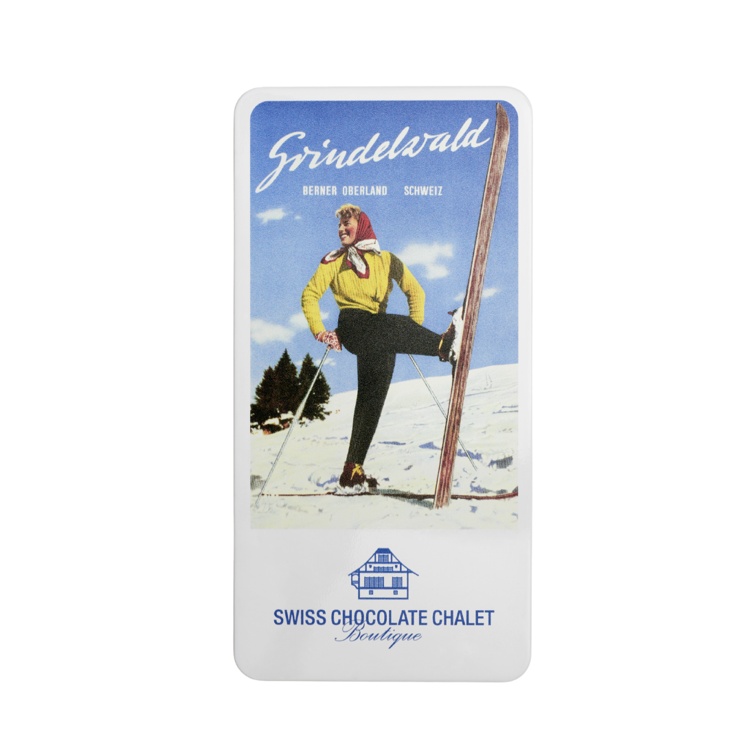 Vintage-Verpackung eines Schweizer Schokoriegels mit Skifahrerillustration und verschneiter Berglandschaft