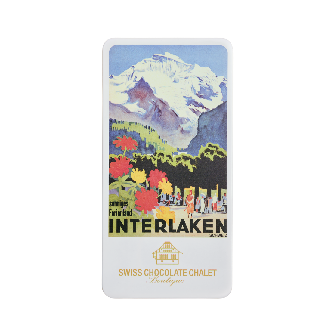 Vintage Schweizer Schokoladenetikette aus Interlaken mit schneebedeckten Bergen und bunten Blumen