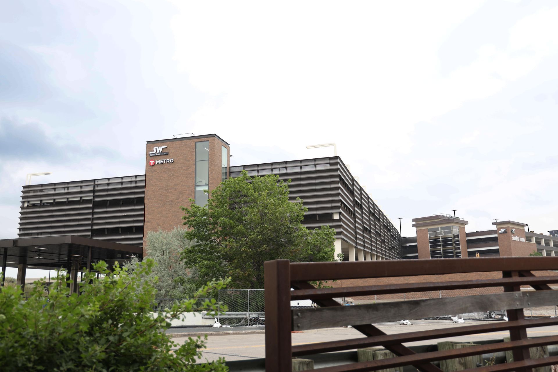 A large building with a fence in front of it