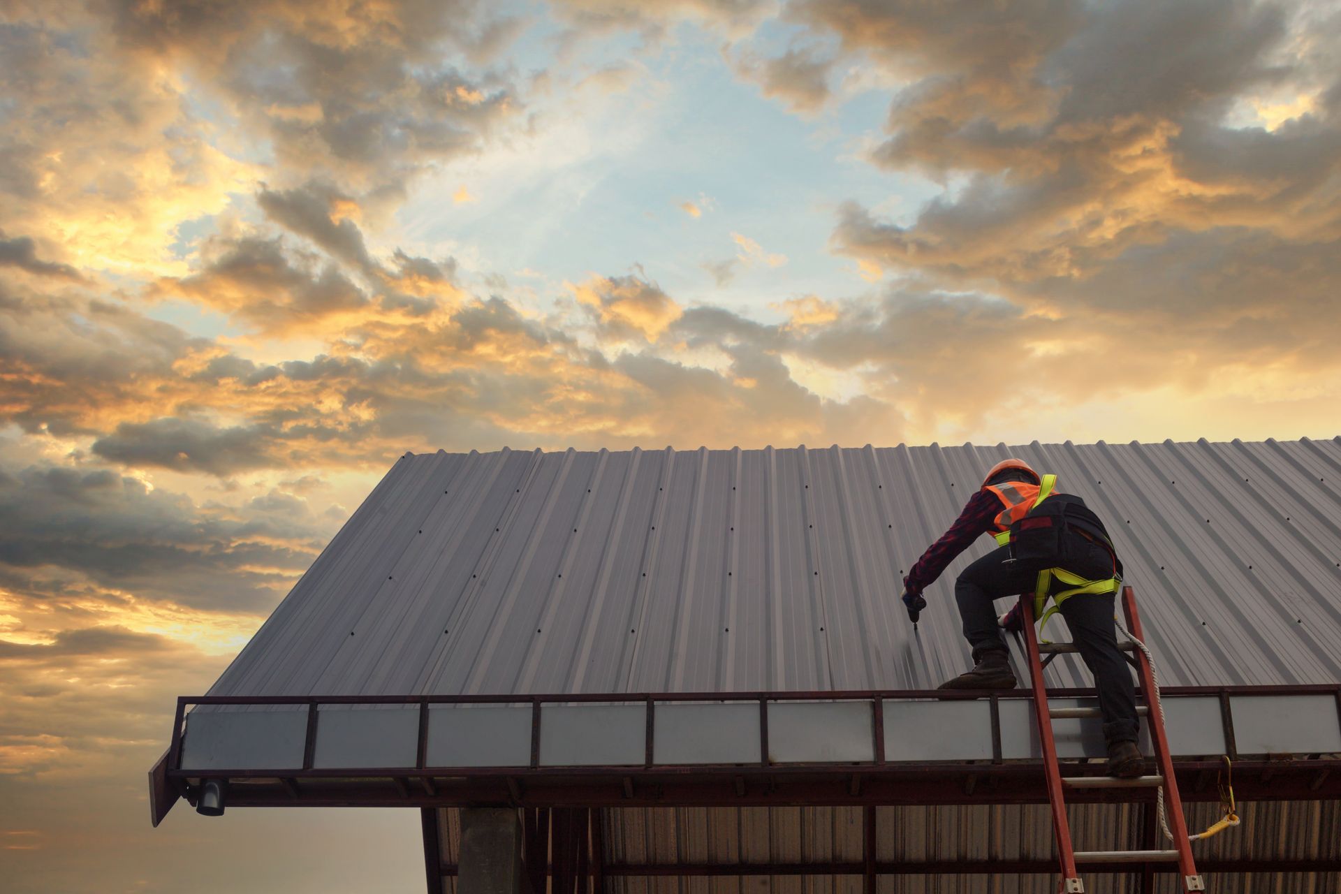 A man is installing a new roof.