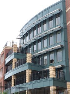 A large building with a lot of windows and balconies