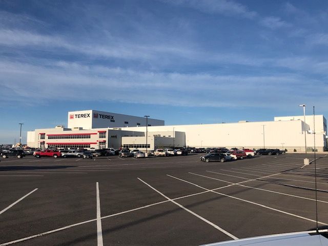 A large white building with the word terex on it