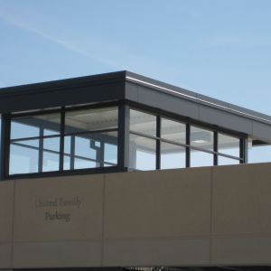 Overhead structure with glass windows, gray roof, and 