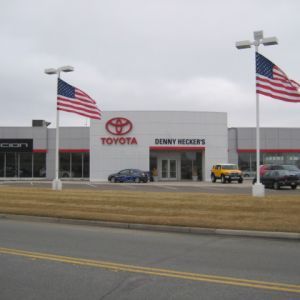 Toyota car dealership with American flags.