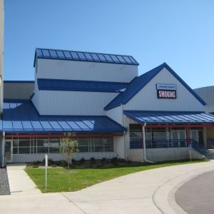 White building with blue roof and trim, 