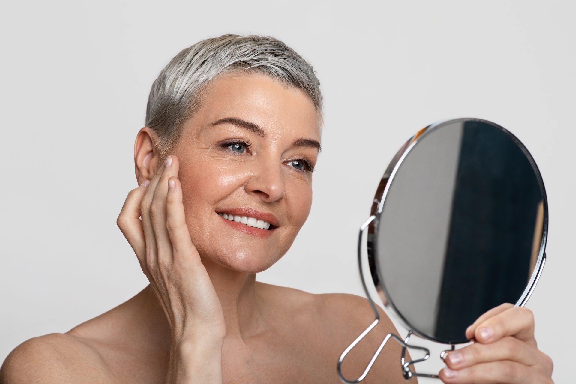 A woman is getting a Botox injection in her face.