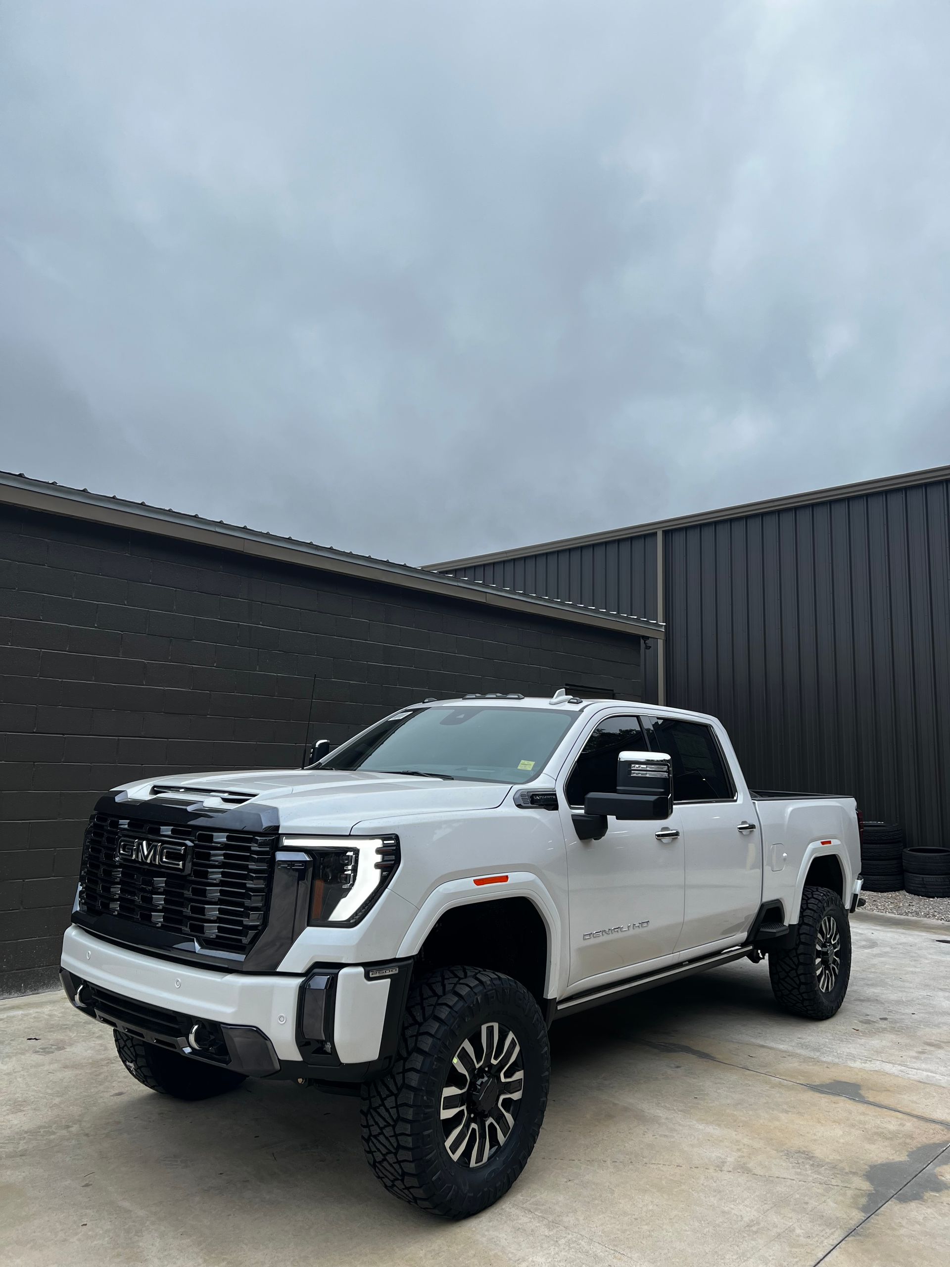 White GMC Sierra AT4 With Black Grille And Custom Wheels | Davis Tire Group