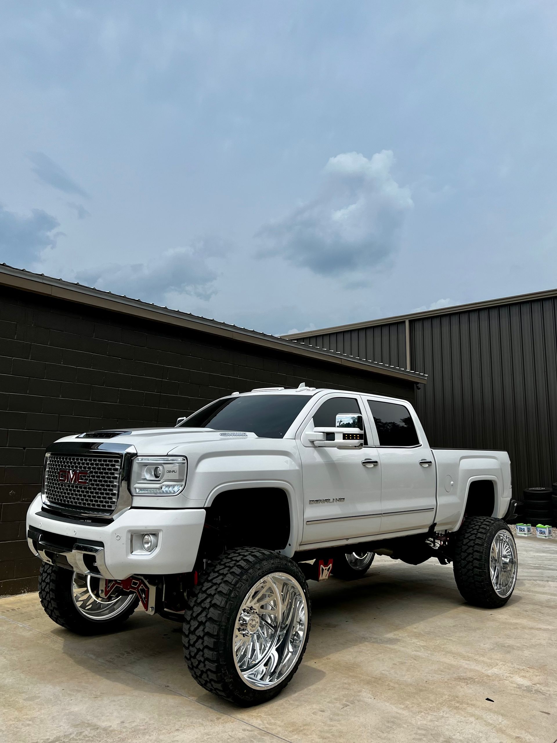 Lifted White GMC Sierra HD Truck With Custom Suspension | Davis Tire Group
