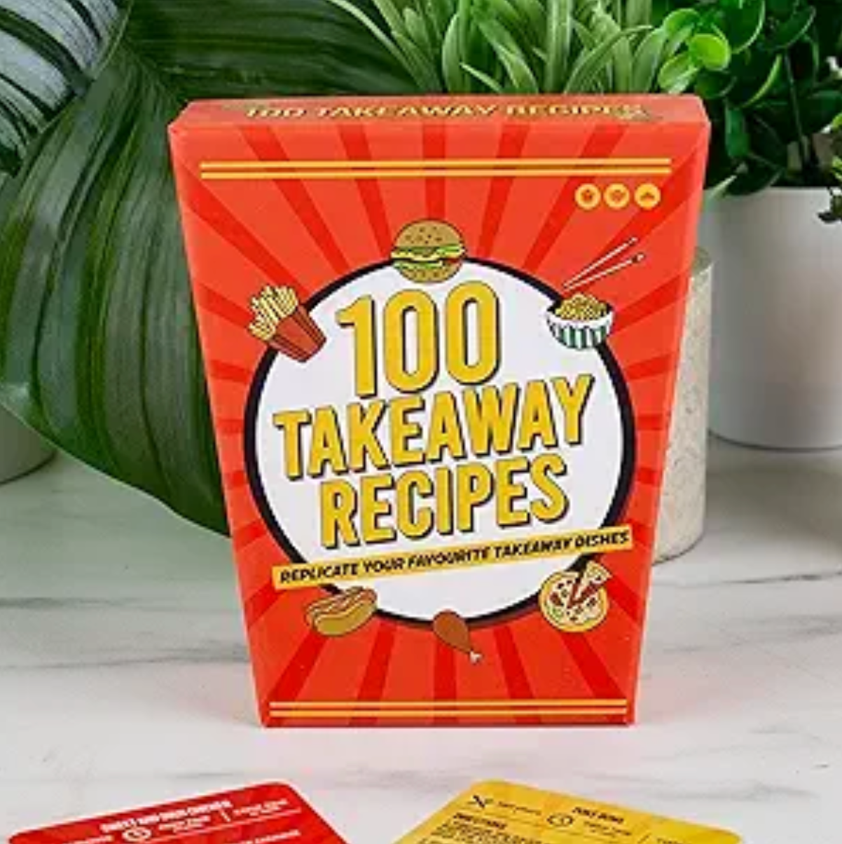 A box of 100 takeaway recipes sits on a table