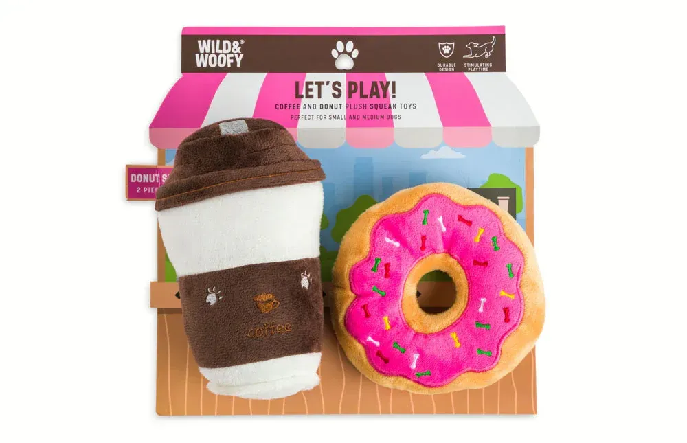 A stuffed coffee cup and a stuffed donut are in a box.