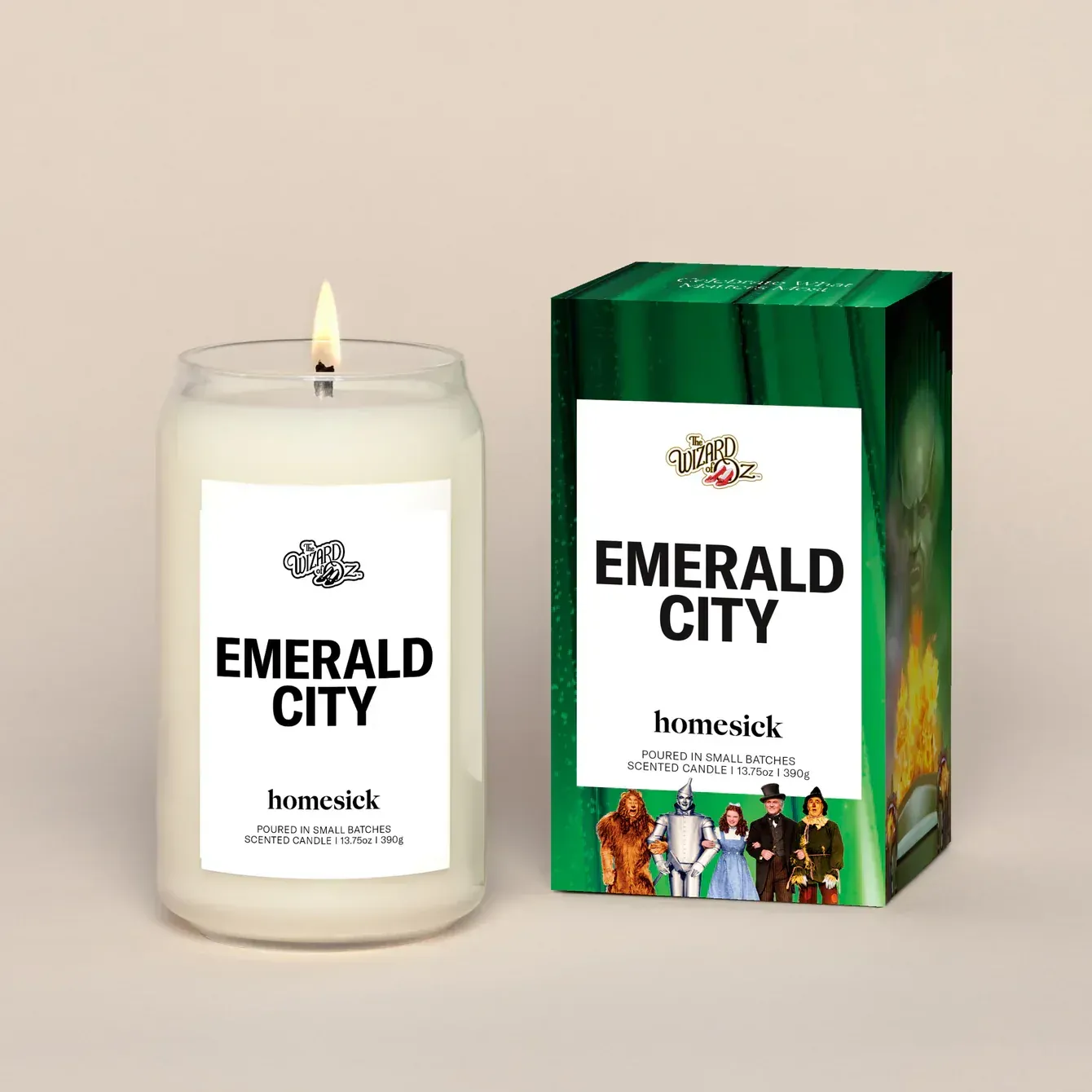 A candle next to a box that says emerald city