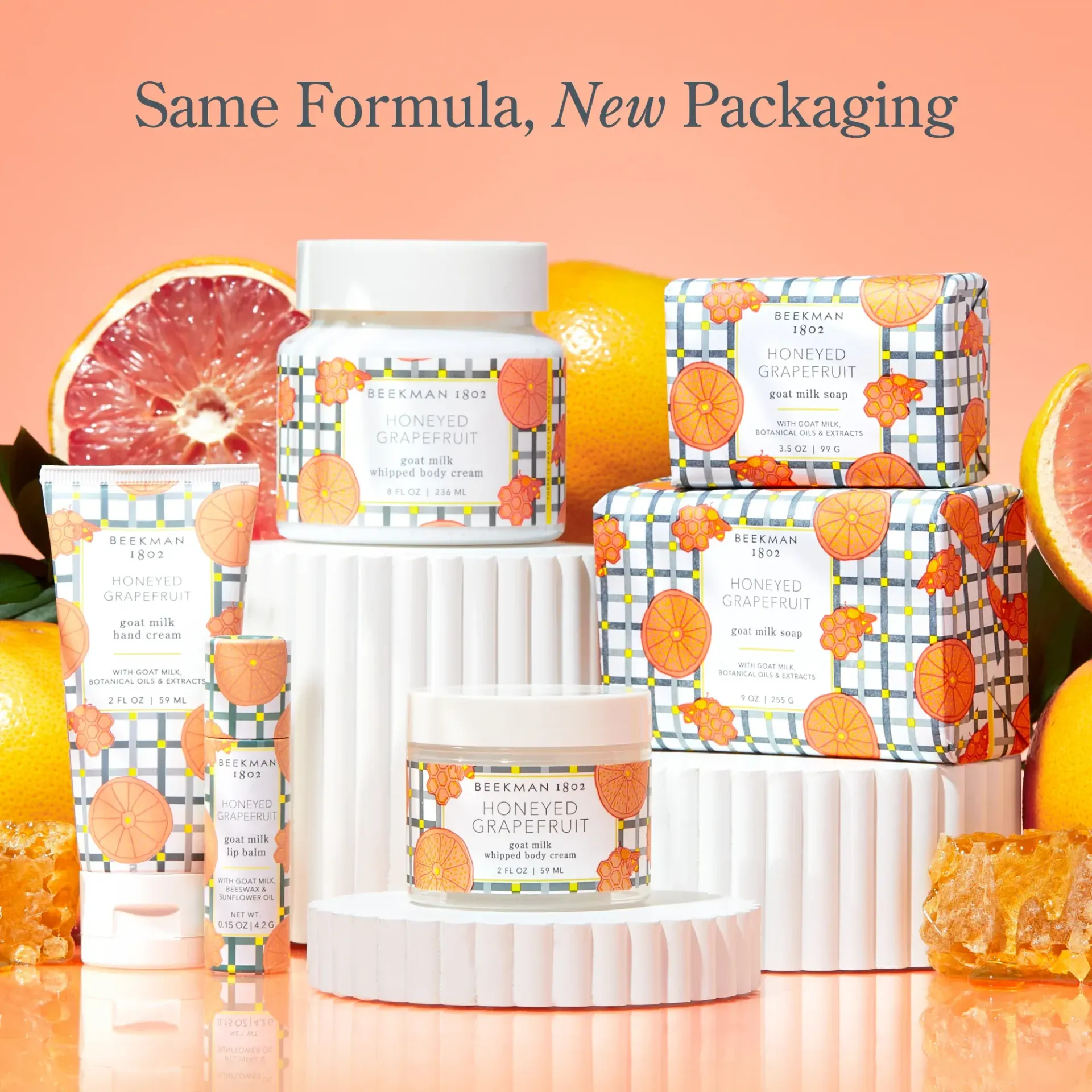 A group of bottles and boxes with the words same formula new packaging