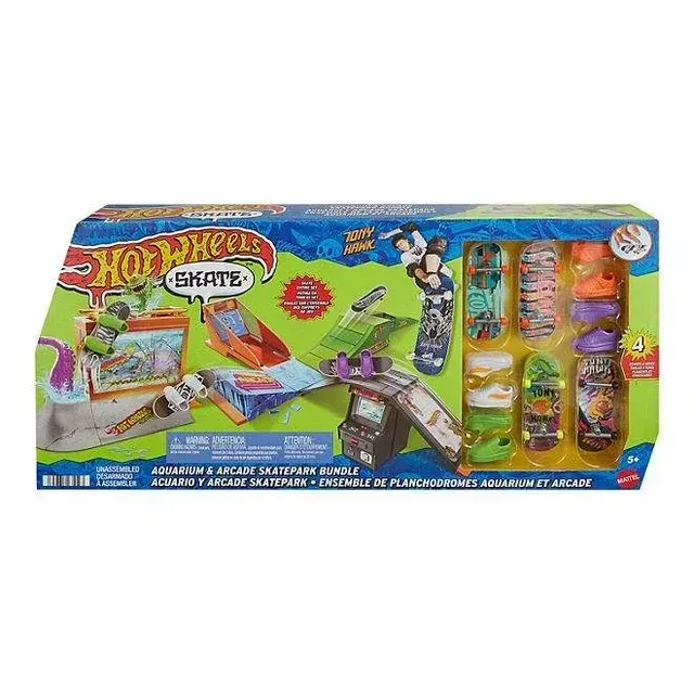 A box of hot wheels skate park with skateboards in it.