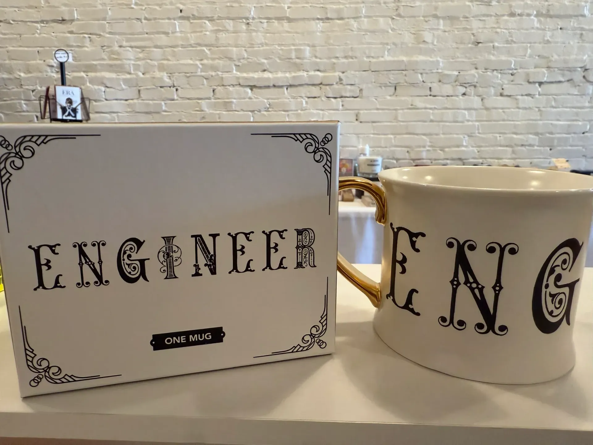 A white mug with the word engineers on it