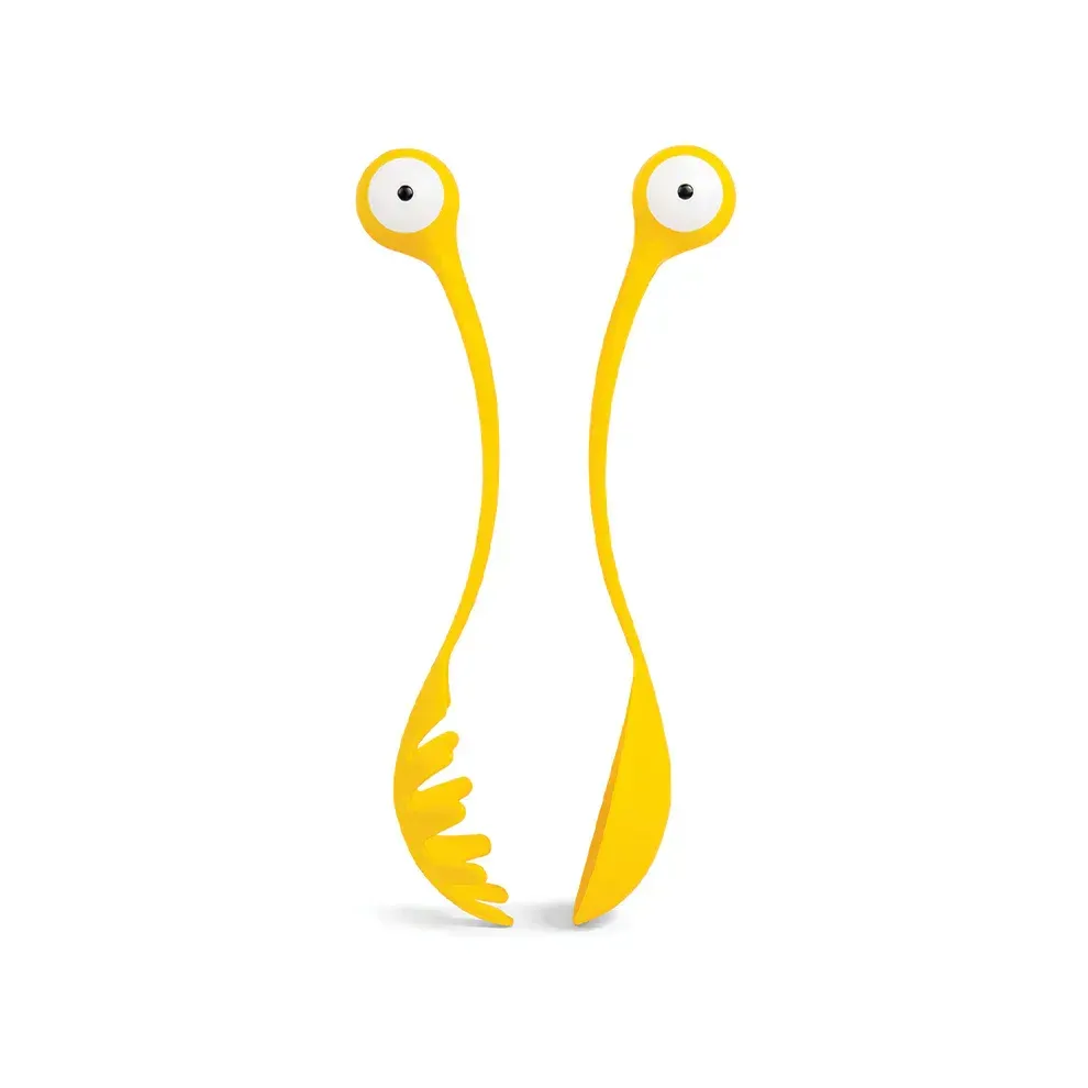 A pair of yellow utensils with eyes on them