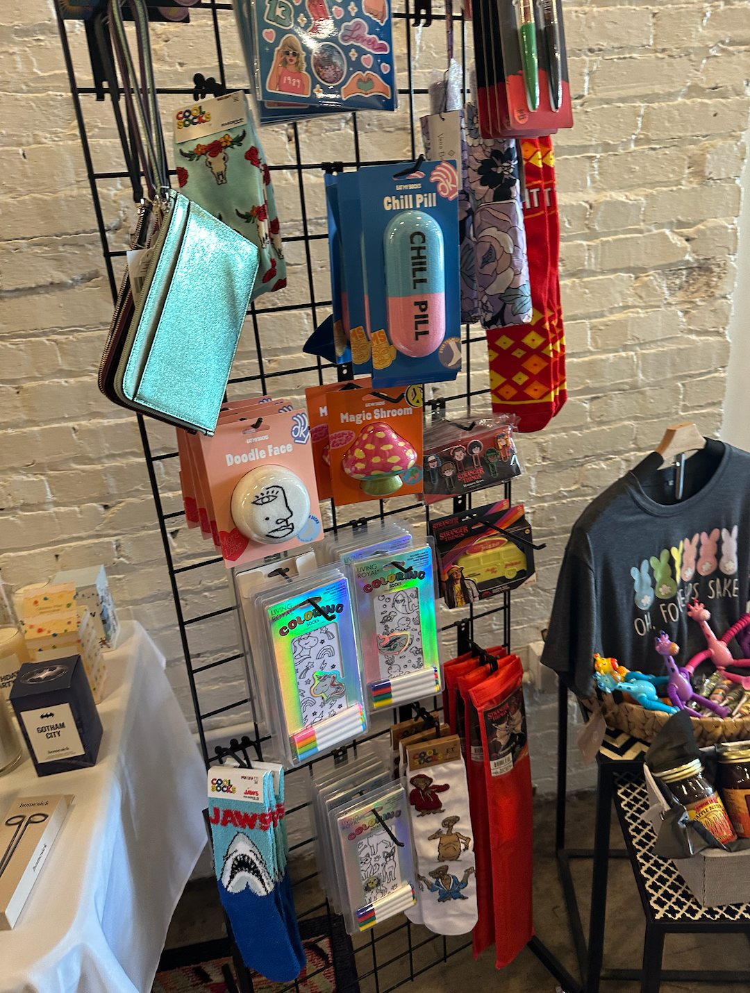 A display of socks , wallets , and other items in a store.