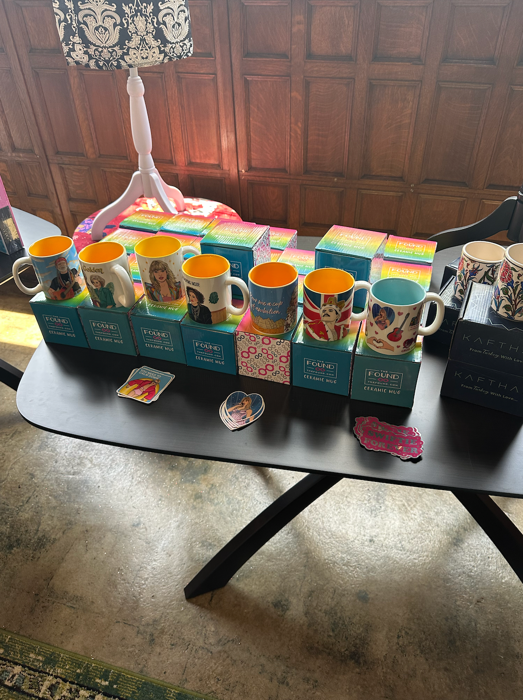 A table with a bunch of mugs on it