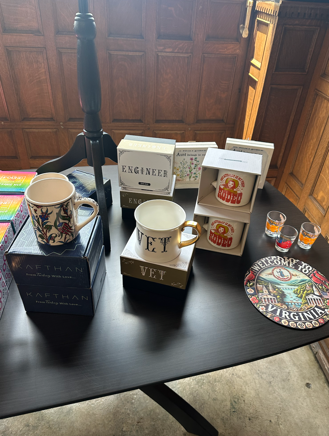 A table with a lot of mugs on it