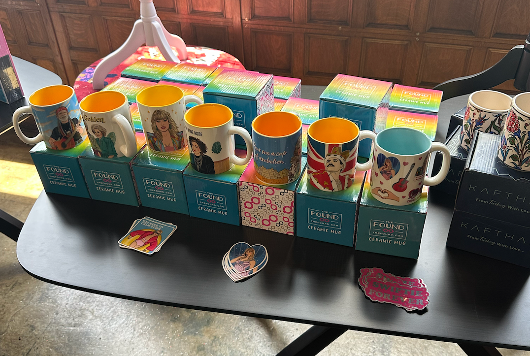 A table with a bunch of mugs on it