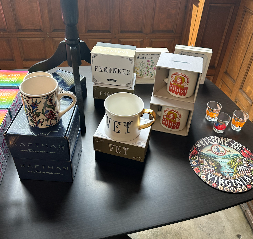 A table with a lot of mugs and glasses on it