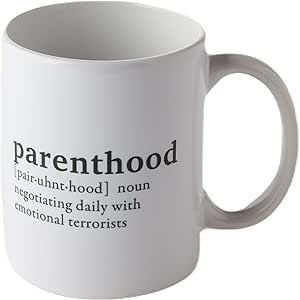 A white coffee mug with the word parenthood on it.