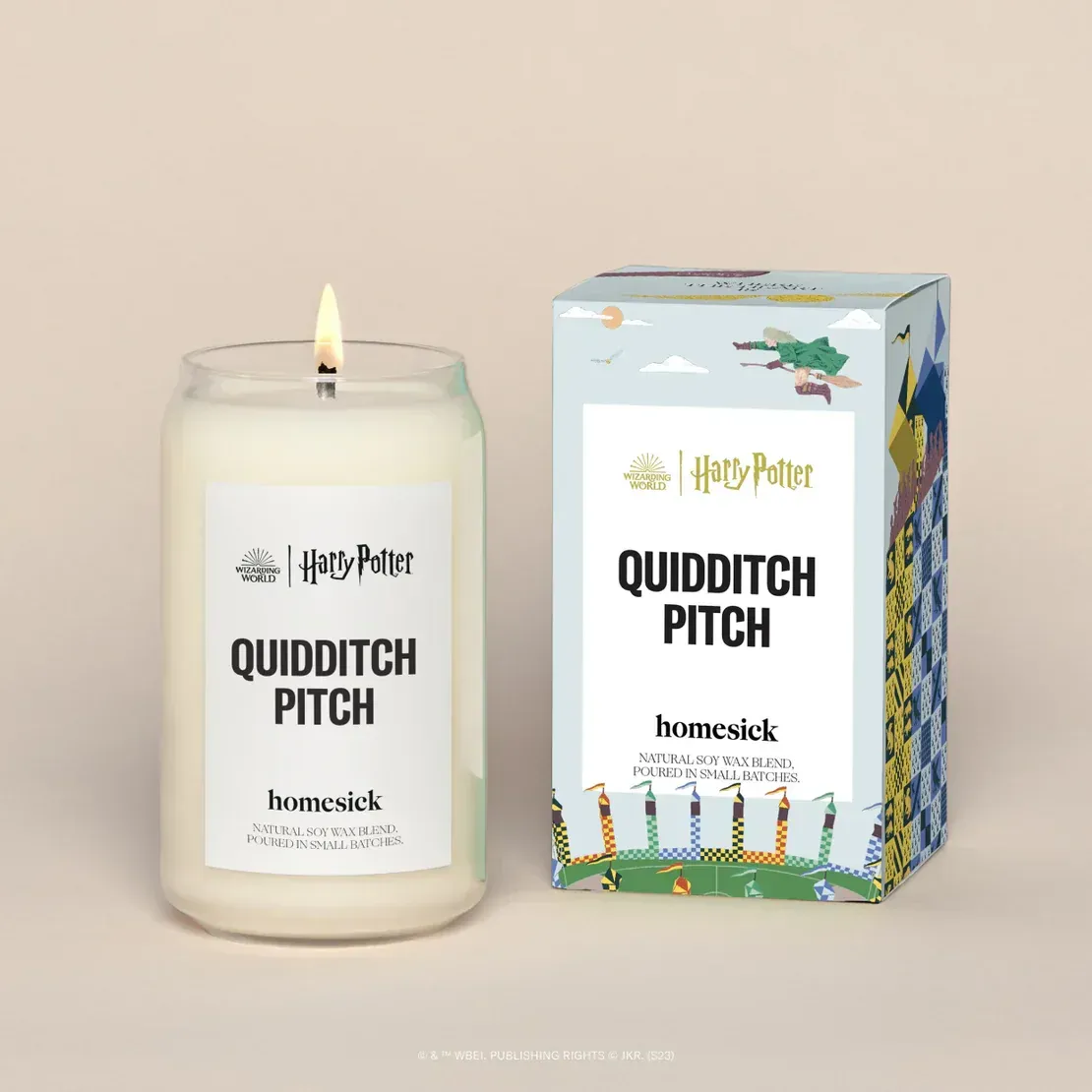 A candle that says quidditch pitch next to a box